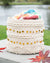 Decorative woven basket with colorful yarn on a natural background