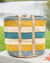 Woven basket with striped pattern on a surface outdoors