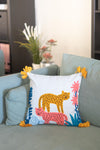 Decorative pillow with animal design on a gray sofa