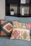 Decorative pillows with geometric patterns on a couch