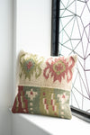 Decorative pillow with geometric pattern on a windowsill