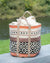 Woven basket with patterned design on a surface outdoors