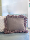 Decorative pillow with tassels on a couch
